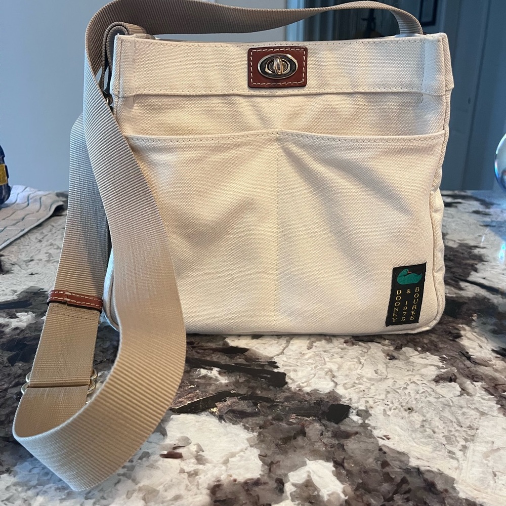 Cream Crossbody Bag with Adjustable Strap and Flap Closure